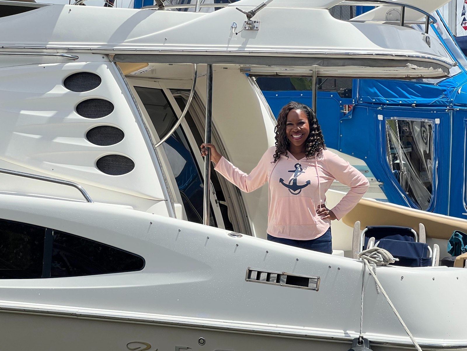 Woman smiling aboard a motor yacht